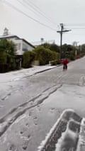 Skier flies down world's steepest street after snowfall in New Zealand – video