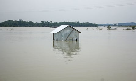 An inundated house beside the banks of the overflown Surma River in Sylhet