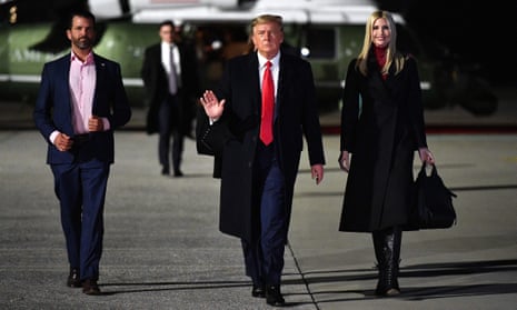 Donald Trump walks with his daughter Ivanka Trump and son Donald Trump Jr to board Air Force One.