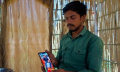 Mohammad Aman showing a photo of his 17-year-old brother Mohammed Anas
who was shot in the abdomen by police in Haldwani, Uttrakhand.