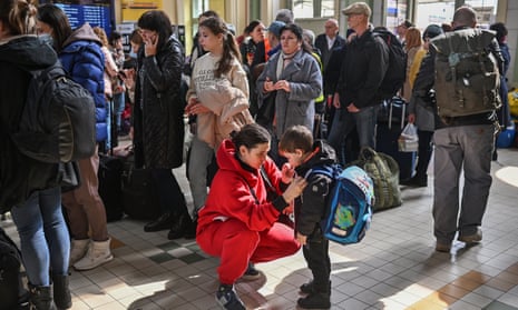 People, mainly women and children, arrive at Przemyśl train station in Poland on Wednesday after travelling from Ukraine.