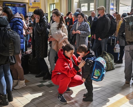 People, mainly women and children, arrive at Przemyśl train station in Poland after journeying from war-torn Ukraine in March 2022.