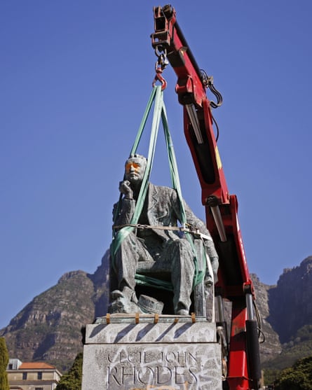 A statue of Cecil Rhodes is removed at Cape Town University after weeks of protest by students.