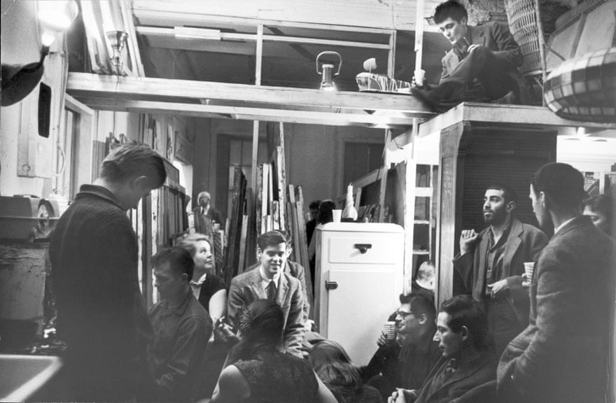 A party in Greenwich Village in 1959 with (from left) Peter Orlovsky, Jack Kerouac, Alice Neel, unidentified, Allen Ginsberg (in glasses, centre), art dealer Richard Bellamy (sitting on loft), Gert Berliner, unidentified ‘Big Table’ writer, and Jonas Mekas (back to camera).