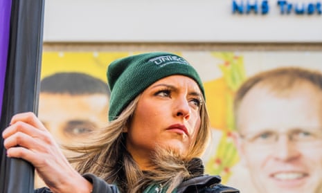 A Unison member on a picket line at the London Ambulance Service HQ at Waterloo on 11 January.