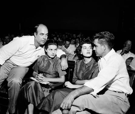In this Sept. 23, 1955, file photo. J.W. Milam, left, and Roy Bryant, right, sit with their wives in a courtroom in Sumner, Miss. Milam and Bryant were acquitted of murder in the slaying of Emmett Till.