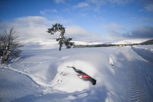 A car is buried in snow in Cabrach in Scotland