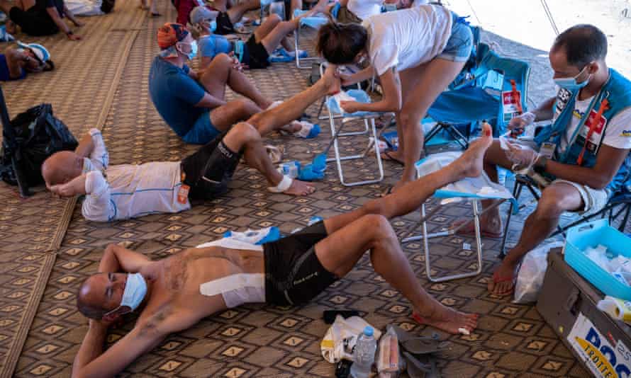Competitors person attraction successful a structure aft Stage 4 of the 35th variation of the Marathon des Sables betwixt Jebel El Mraier and Boulchrhal successful the confederate Moroccan Sahara desert.