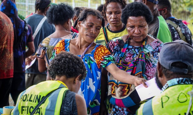 Women cast their vote at the North-East electorate in the capital, Port Moresby