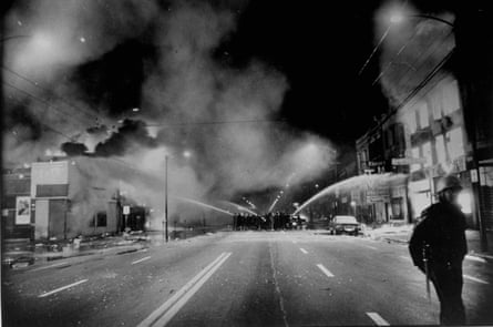 Chicago firemen fight blazes during race riots following murder of Martin Luther King.