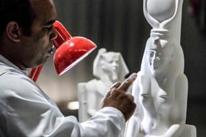 A technician crafts a replica of an ancient Egyptian statue at the Egyptian government’s Konouz (Treasures) factory in Obour
