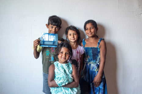 From left to right: Ercan, Sania, Belfina and Medina, back in Macedonia, pose with the picture of two trapped foxes they helped safe while living in Berlin.
