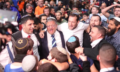 Israeli national security minister Itamar Ben Gvir (centre) dances at a conference calling for the re-establishment of Israeli settlements in the Gaza Strip