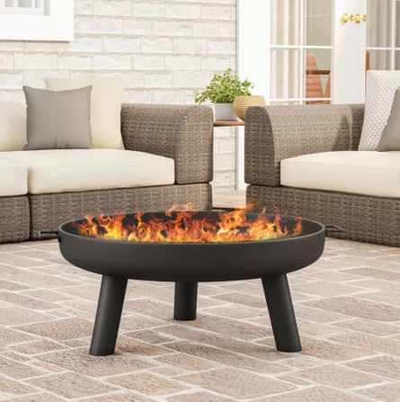 fire in a small pit on a nice outdoor patio
