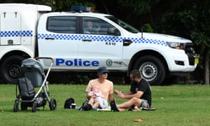 NSW police officers patrol Rushcutters Bay park in Sydney on Wednesday 1 April. Australia’s coronavirus lockdown rules and restrictions come with hefty fines in some states – and seem to change daily. Can you visit your family or parents at Easter, or go for a drive over the long weekend?