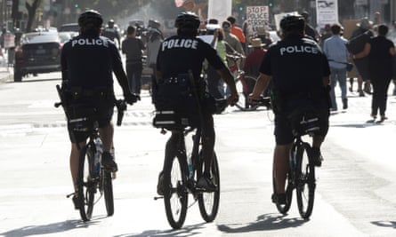 LAPD bicycle officers follow a march in downtown Los Angeles.