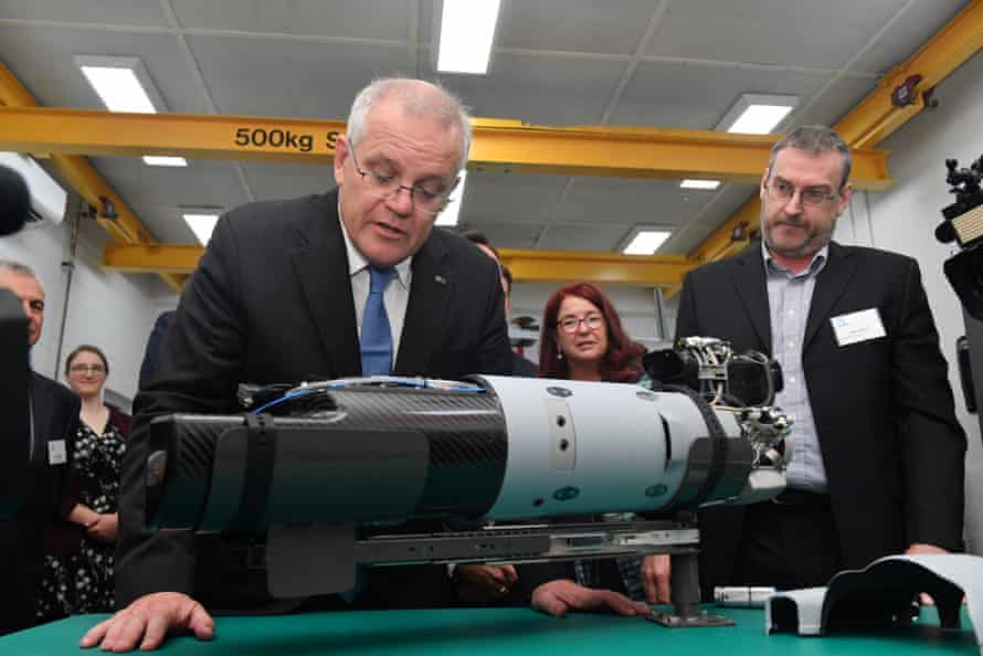 Prime minister Scott Morrison looks at a Scan Eagle drone engine during a visit to Orbital UAV in Perth.