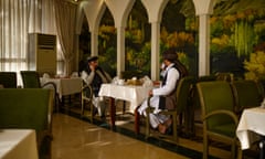 A manager and a Taliban government official in the dining room of the Intercontinental Hotel in Kabul. Photograph: Elise Blanchard/Elise Blanchard for NZZ