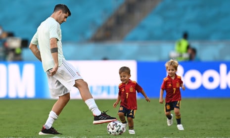 Álvaro Morata plays football with two of his children after Spain’s win against Slovakia at Euro 2020.