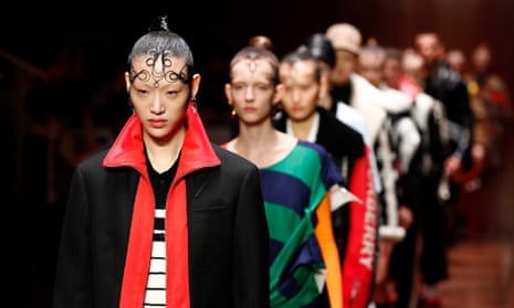 Models walk the runway at the Burberry show during London fashion week on Sunday