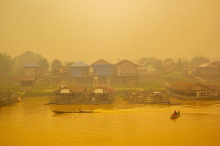 Thick wildfire haze shrouds the Kahayan River in Palangkaraya, Central Kalimantan