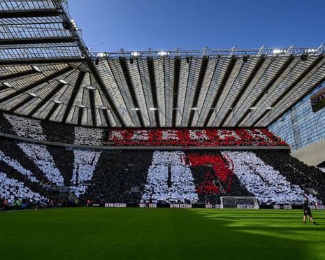 Fans use cards to make up Keegan's Newcastle shirt, with Liverpool fans (in red) playing their part high in the away end.