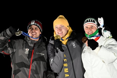 the silver medallist Jonas Müller of Austria, gold medallist Max Langenhan of Germany and bronze medallist Dominik Fischnaller of Italy after the men’s singles luge