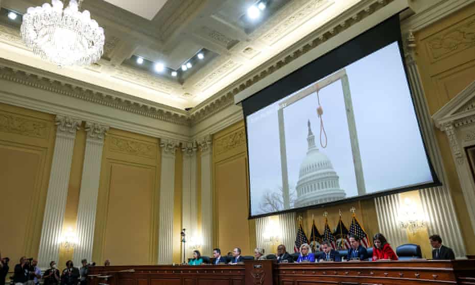 An image of a noose and gallows that were outside of the US Capitol on January 6 is displayed on a screen during the first public January 6 committee hearing.