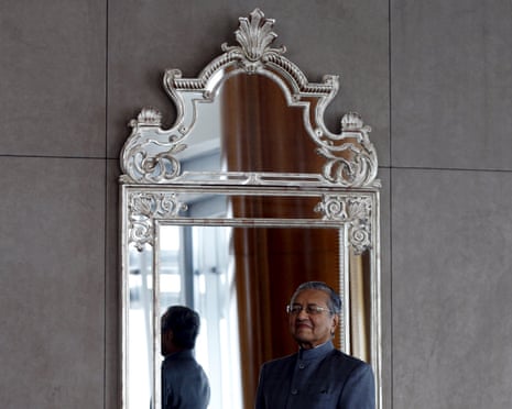 Malaysia's former prime minister Mahathir Mohamad poses for a photograph following an interview with Reuters at his office in Petronas Towers, Kuala Lumpur, Malaysia, October 22, 2015. Mahathir conceded on Thursday that the chances of unseating Prime Minister Najib Razak before elections in 2018 are slim, despite his rallying cries for a "people's power" movement to topple the country's leader. The 90-year-old statesman, who led Malaysia for 22 years, has called on Najib to step down following allegations of corruption and mismanagement at state-owned fund 1Malaysia Development Berhad (1MDB). To match Interview MALAYSIA-POLITICS/MAHATHIR REUTERS/Olivia Harris