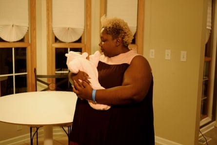 Jazmin Long, Vice President of Fund Development, nurses a baby at the Birthing Beautiful’s headquarters.