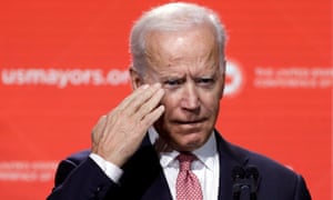 Joe Biden salutes the audience at the United States Conference of Mayors winter meeting in Washington.