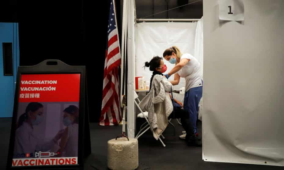 A healthcare worker administers a shot of the Moderna Covid-19 vaccine at a pop-up site in New York City on 29 January 2021.
