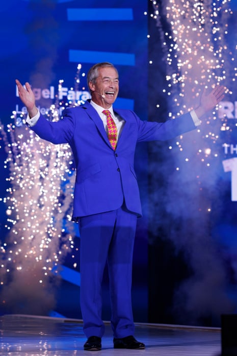 Nigel Farage walks on stage to fireworks.