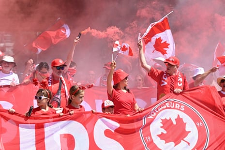 Members of the Voyageurs, Canada’s national team supporters, march toward Toronto Stadium.