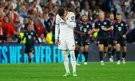 Real Madrid's Federico Valverde looks dejected after Bayern Munich's Alphonso Davies scores their first goal.
