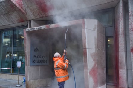 A worker cleans the MoJ building.