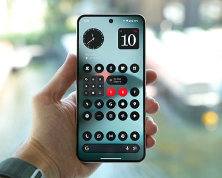 The Nothing Phone 3 held in a hand showing the home screen.