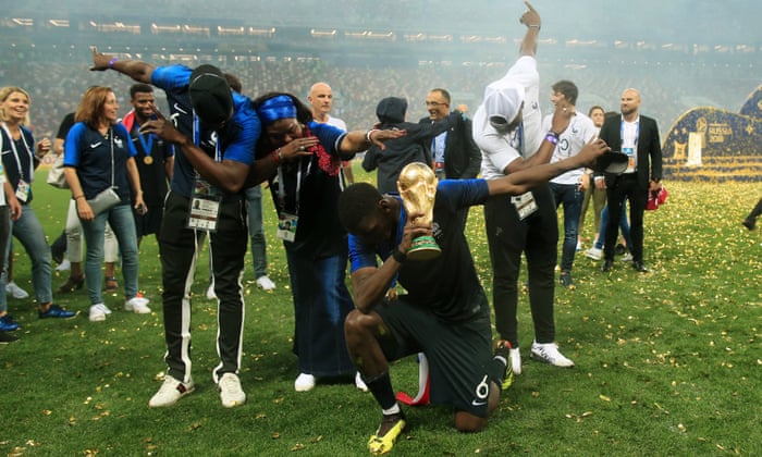 Paul Pogba of France celebrates with his mother, Yeo, and brothers Mathias and Florentin as they perform a dab with the trophy.