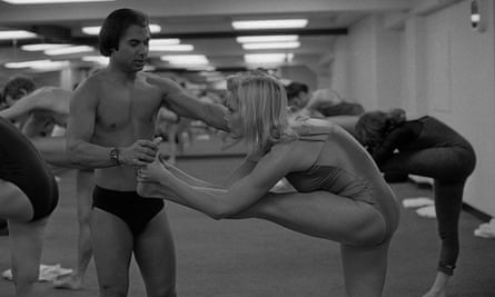 Bikram Choudhury assists actress Carol Lynley at his yoga studio in Beverly Hills, California.