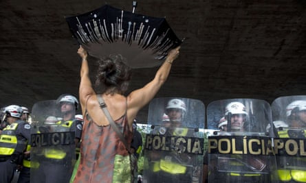 A demonstrator protests over the lack of water in front of riot police in São Paulo’s central Paulista Avenue in February 2015.