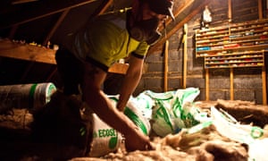 Sustainable loft insulation made from wool being installed in a roof in Kirklees, UK