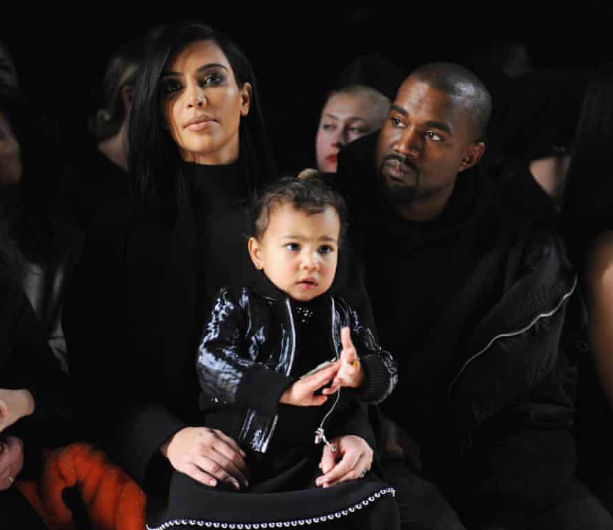 Kim Kardashian with North West and Kanye West at the Alexander Wang Fashion Show in February 2015 in New York City.