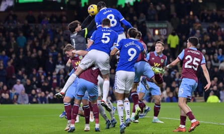 Amadou Onana outjumps Burnley goalkeeper James Trafford to score