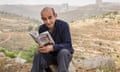 Shehadeh reads his Orwell prize-winning book, Palestinian Walks, outside Ramallah, in the West Bank, 2014.