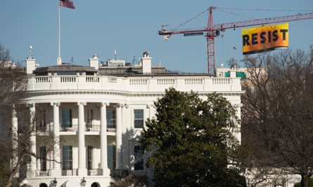 The Greenpeace banner behind the White House.