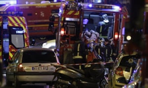 An injured man is evacuate following the attack in the 10th arrondissement in Paris
