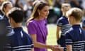 The Princess of Wales shakes hands with a ballboy standing line on Centre Court