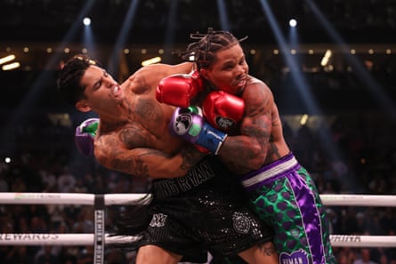 Ryan Garcia, left, and Gervonta Davis roughhouse during Saturday’s fight at the T-Mobile Arena in Las Vegas.