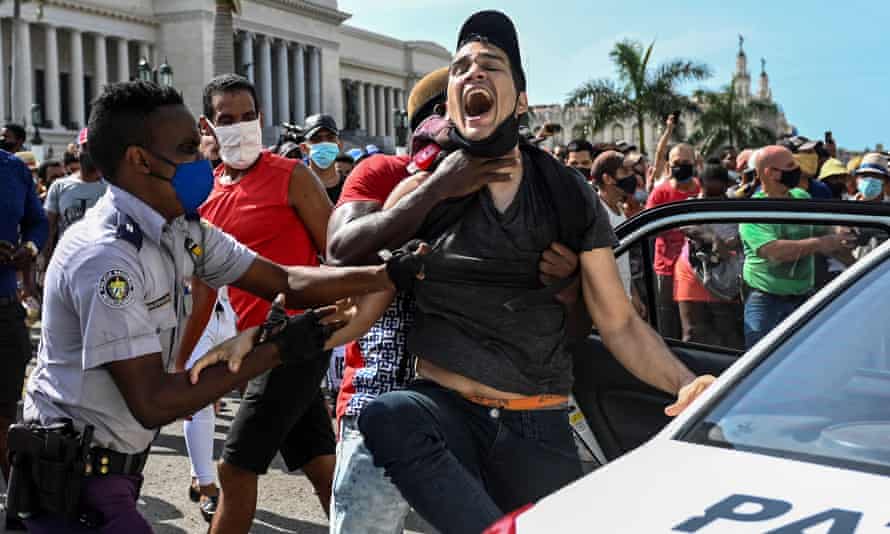 A man is arrested during an anti-government demonstration on 11 July 2021. Protesters have been sentenced to long prison terms.