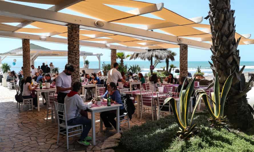 Protests grow in fight to reclaim Italy’s beaches from private clubs | Italy 1 A beach-side restaurant in Ostia, Italy.